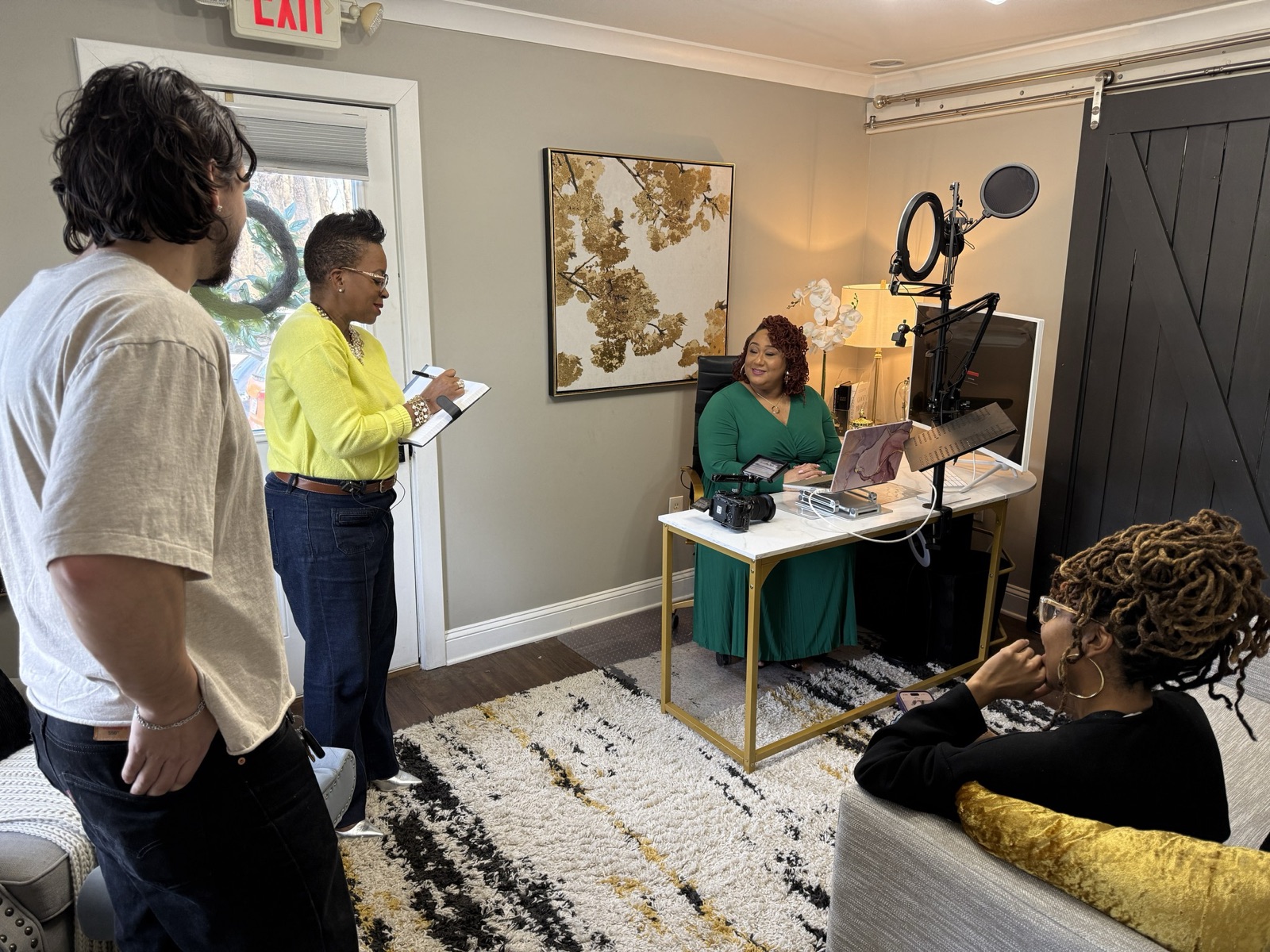 Focus Films crew with a client at their desk