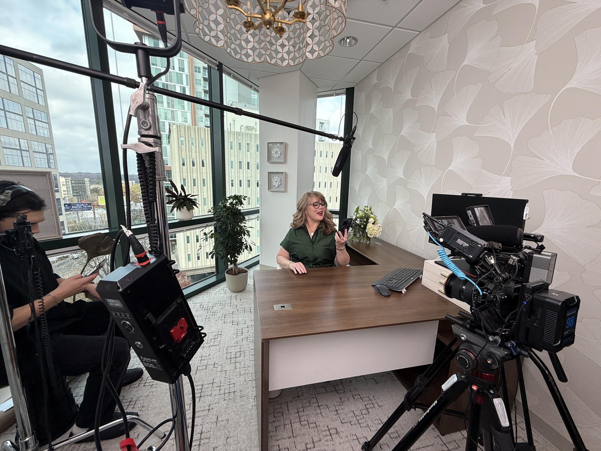 Focus Films crew filming a client interview with two cameras in a downtown office